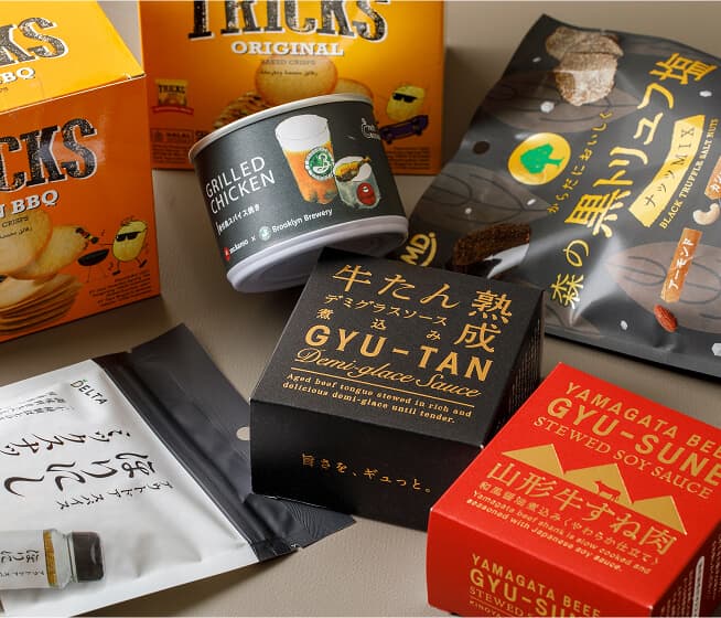 【商品イメージ写真】牛たんや山形牛の缶詰や、TRICKSのベイクドチップスなどのおつまみが並んでいます